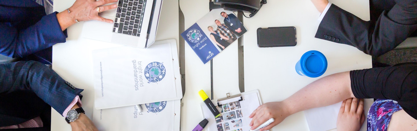 Bright World documents at a meeting